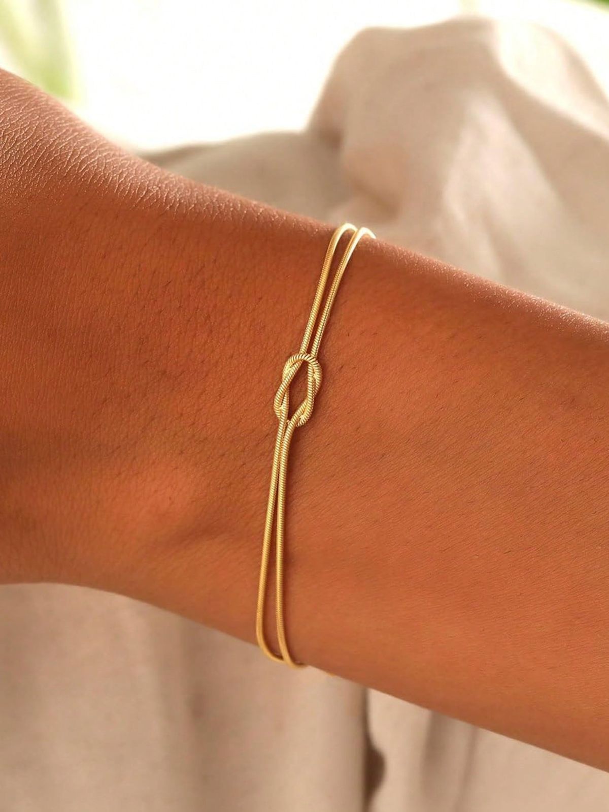 The Eternal Knot: Minimal Gold Rakhi